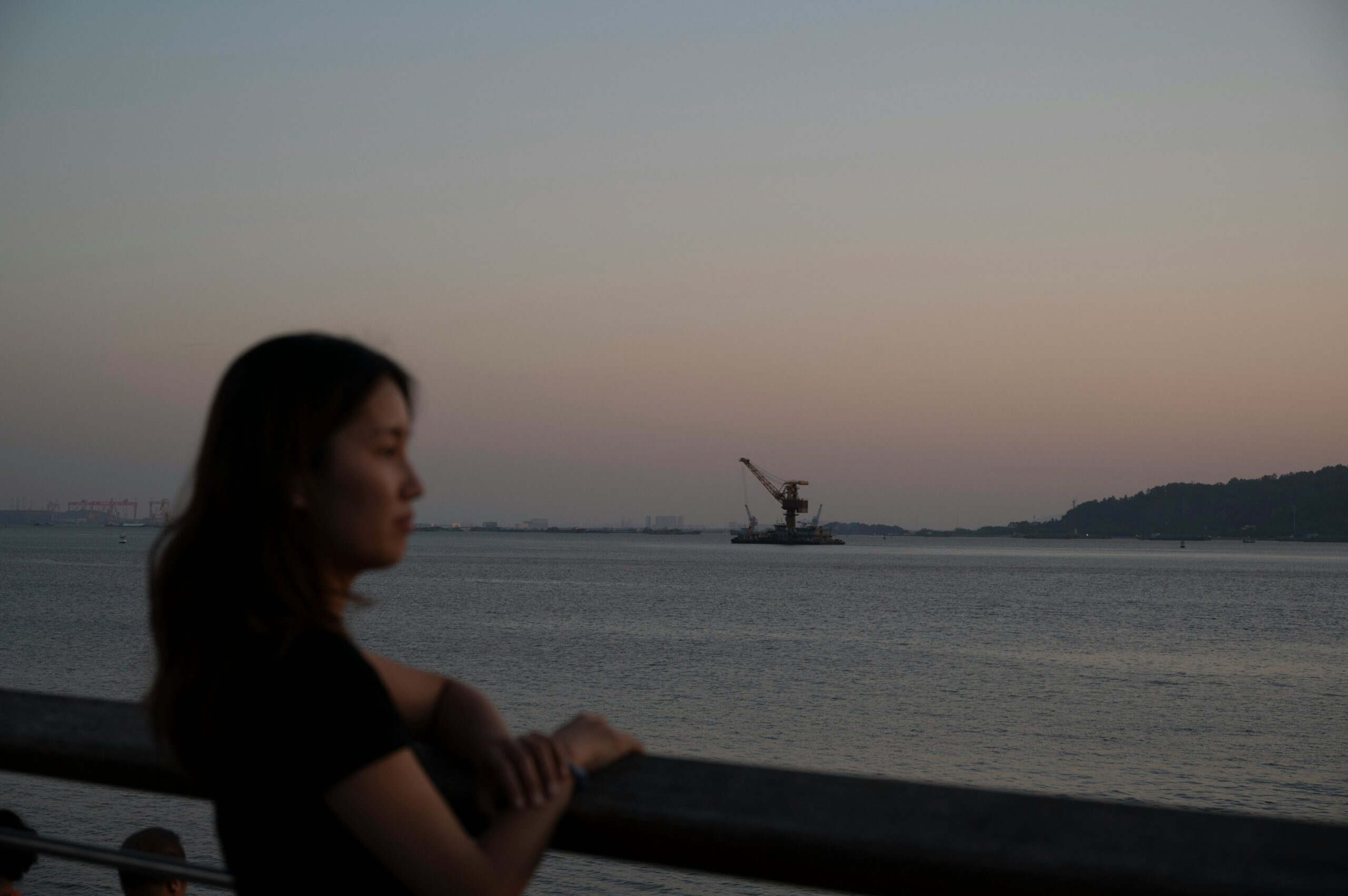Woman doing gentle yoga in a peaceful evening setting