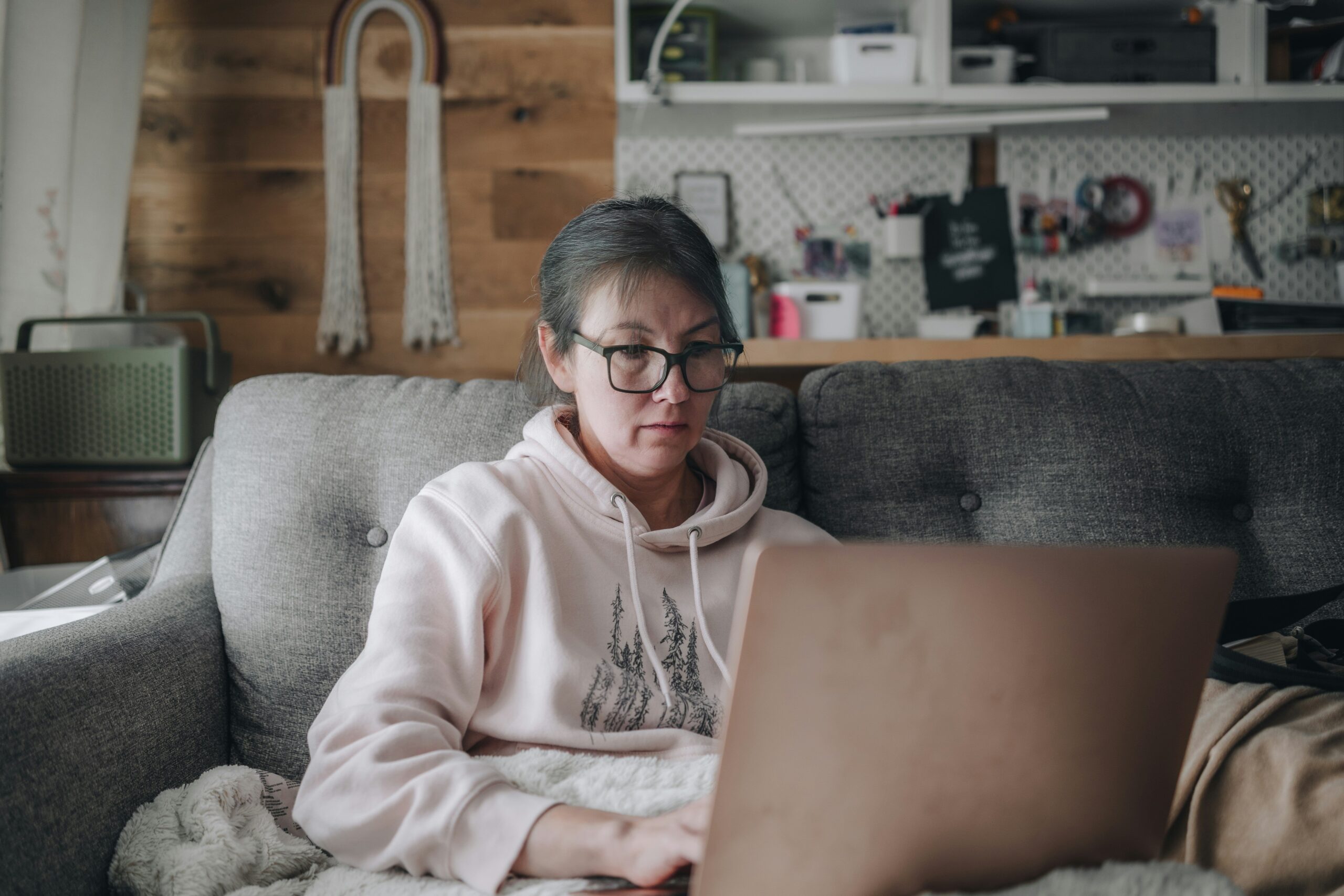 Illustration of a parent juggling work documents and children