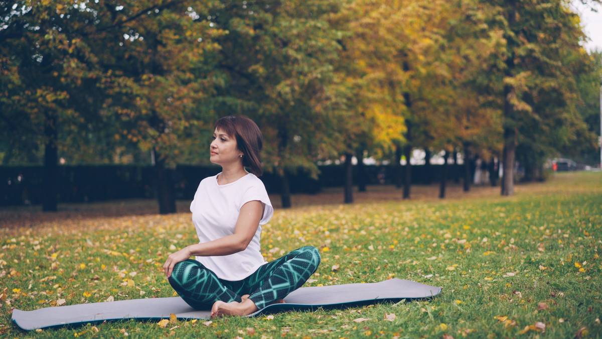 Person practicing mindfulness meditation near a window.