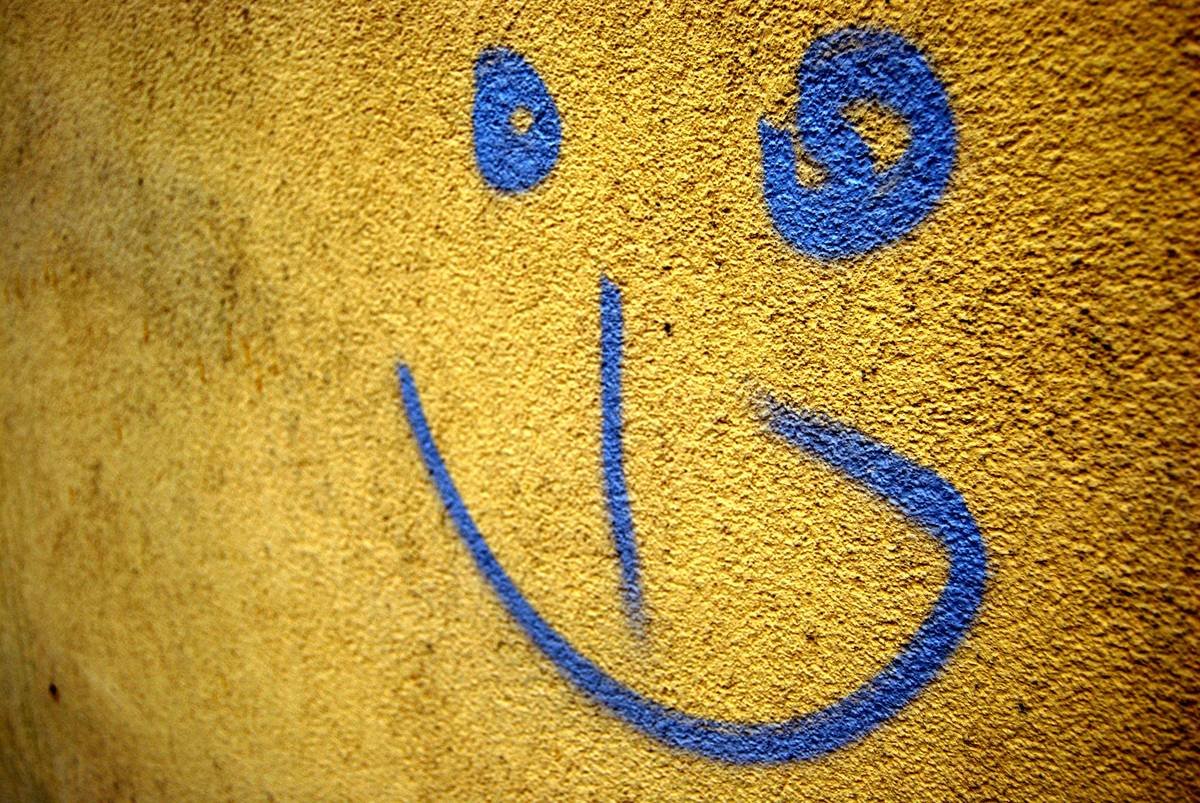 A graffiti photo of a smiling face :)