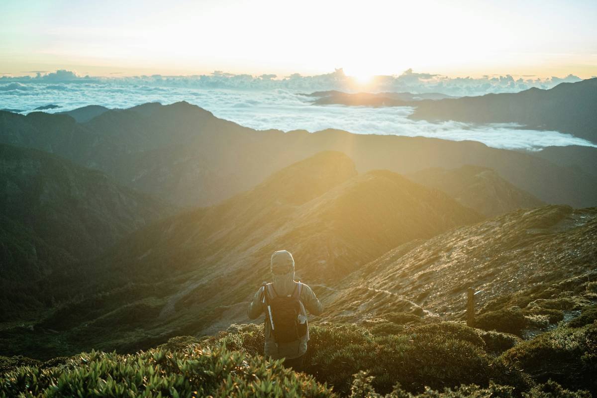 a person standing on a mountain