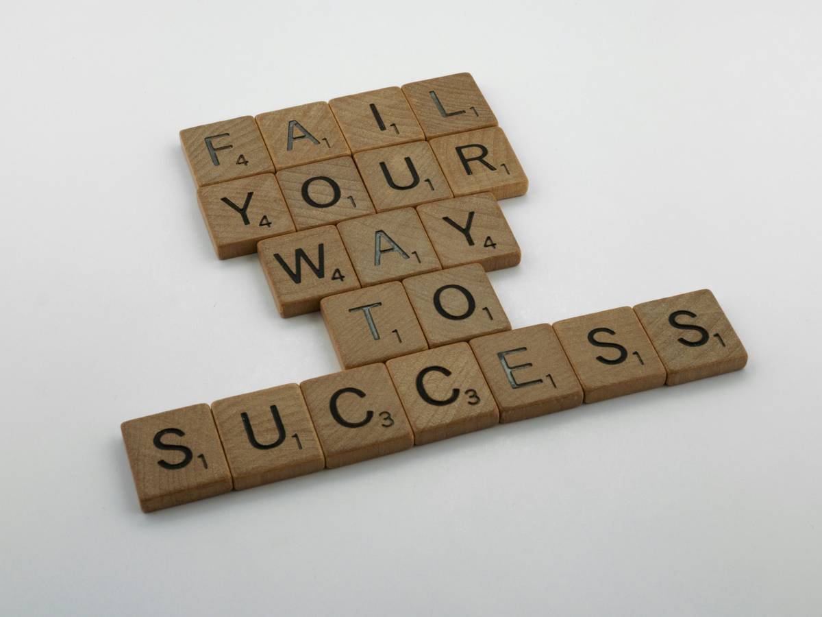scrabble, scrabble pieces, lettering, letters, wood, scrabble tiles, white background, words, quote, fail your way to success, persevere, don't give up, try again, get up, move on, keep innovating,