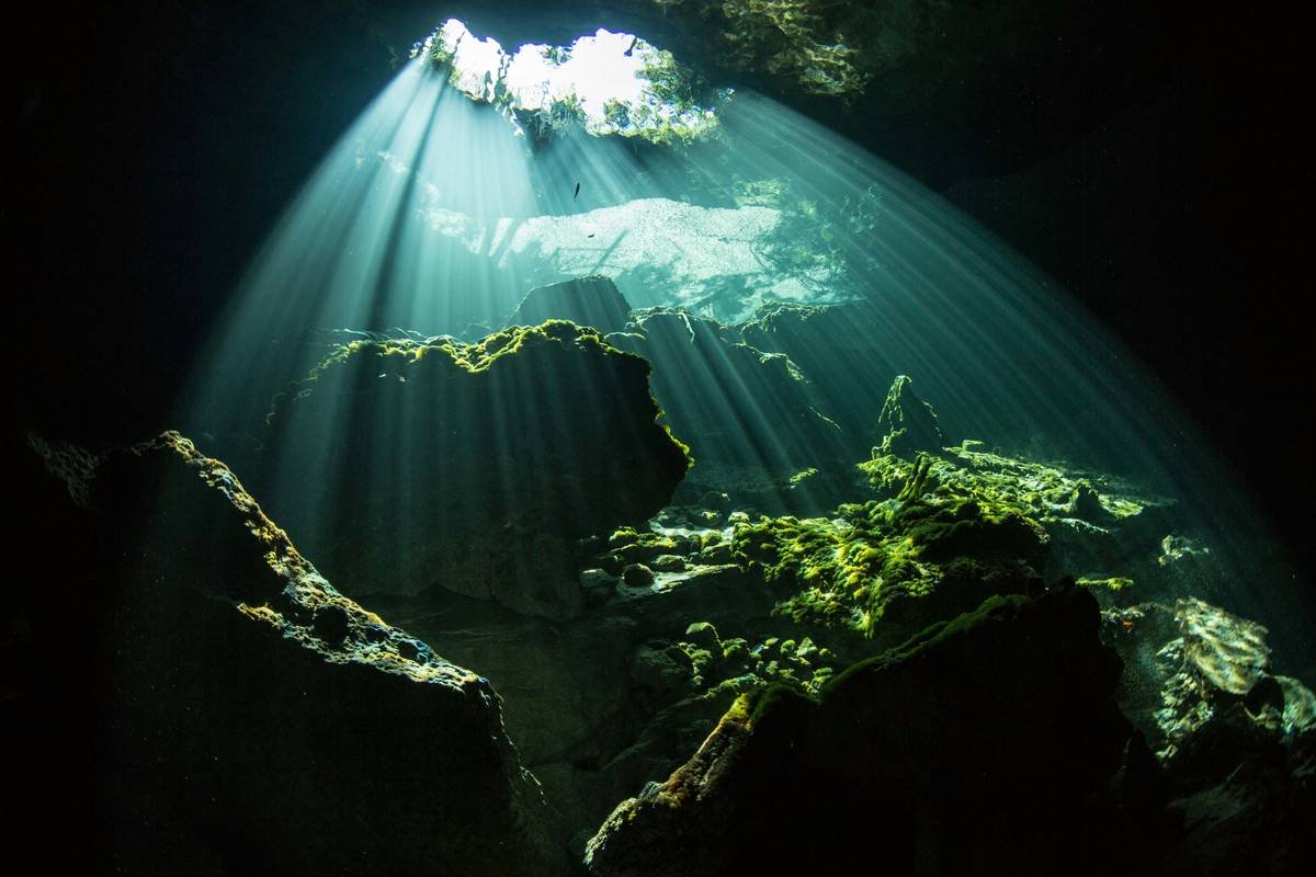 The entrance to Ben's Cavern in the Bahamas. At the proper time of day, the light rays pouring into this underwater eden are nothing short of magical.