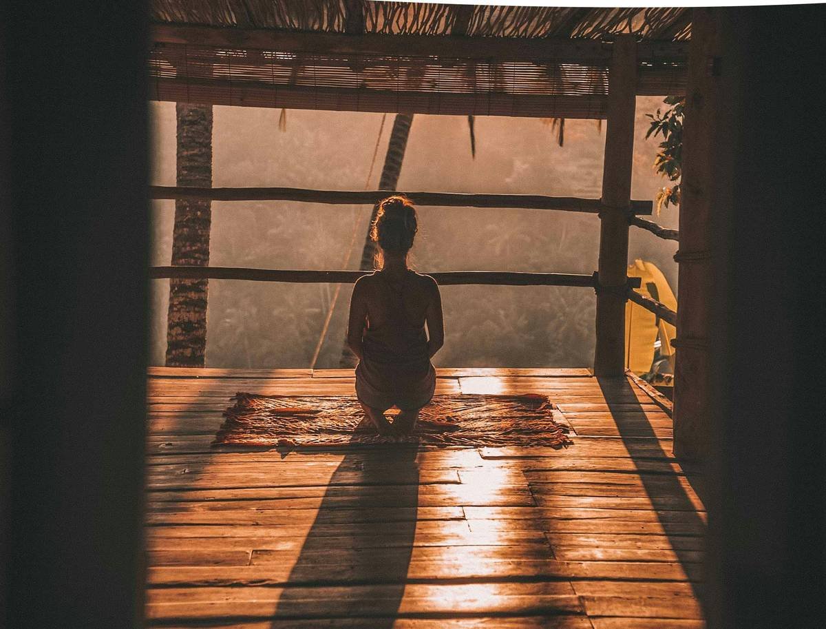 Woman practicing stress reduction in balance with morning breathing routine